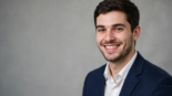 Professional AI-generated LinkedIn headshot of a smiling young professional